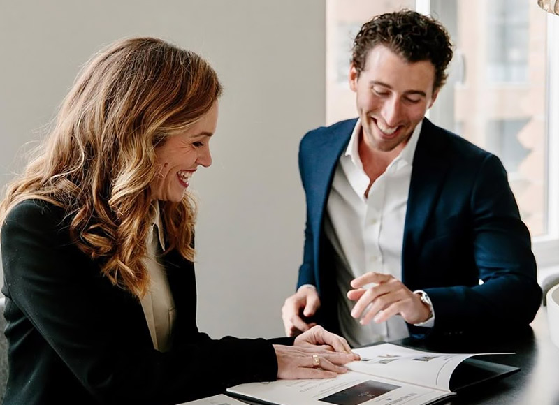 business professionals review a document